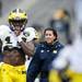 Michigan safety Josh Furman smiles and warms his hand on the sideline during the spring football game on Saturday, April 13. AnnArbor.com I Daniel Brenner